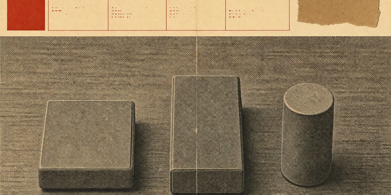 Three small plain electronic devices arranged in a row on a desk, seen from directly overhead.
