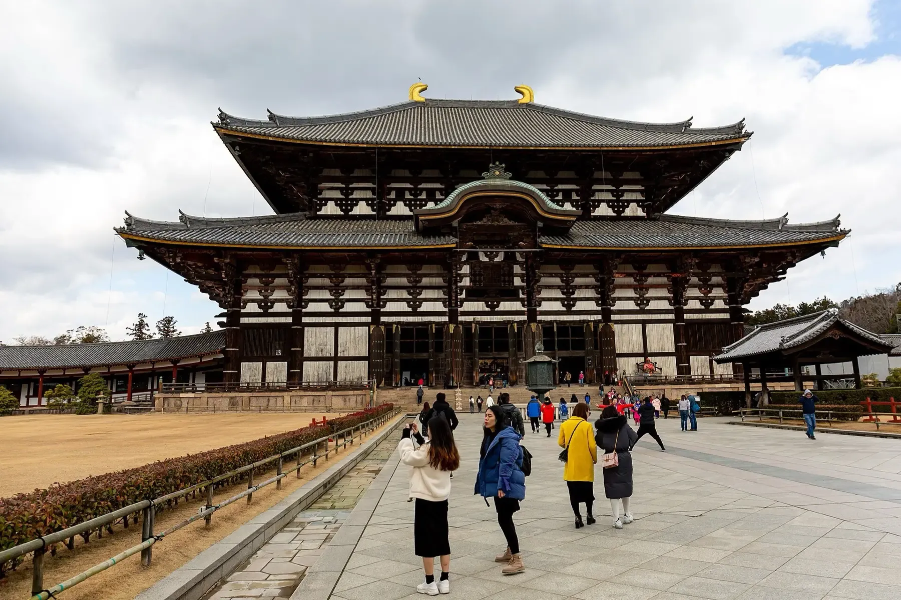 The Great Buddha Hall at Todai-ji seen from the approach, with visitors walking towards it