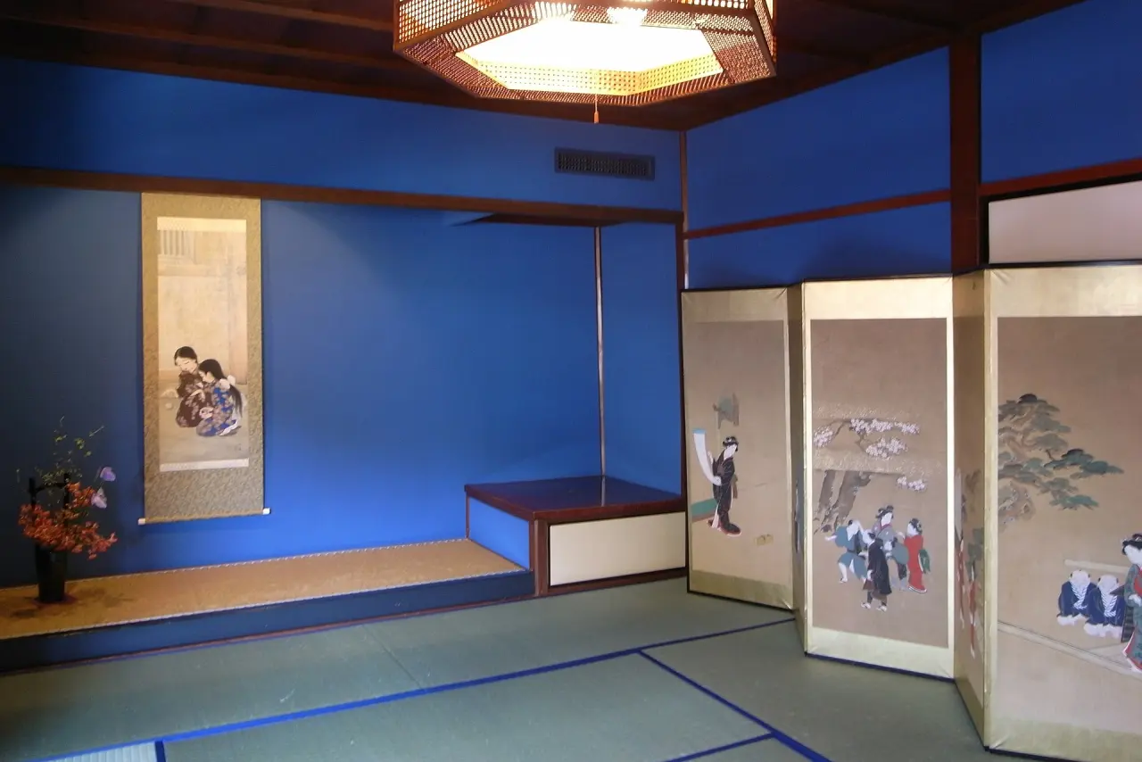 A tatami room with ultramarine walls inside the Kaikaro teahouse, Higashi Chaya District, Kanazawa